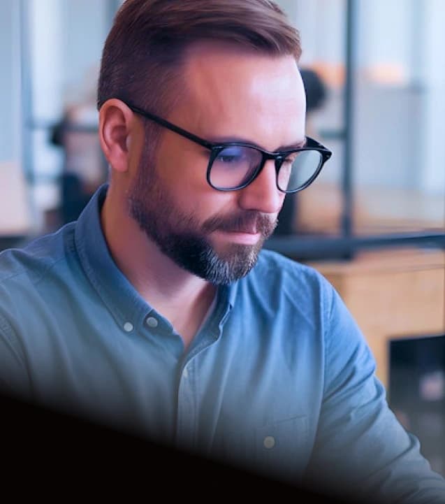 Product builder reviewing plans on laptop